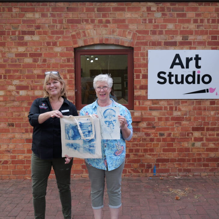 Mary Hemingway poses alongside Kaz Pedersen with some of her art at the Fullarton Arts Studio
